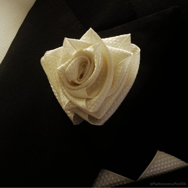 Very Papilionaceous Petal Pin styled from our own rose pink jacquard silk ribbon mounted on a Sterling Silver stick pin. Silk Boutonniere on vintage dinner suit.